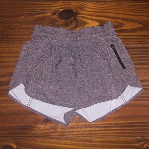 Lululemon grey heathered tracker shorts. 4in seem.